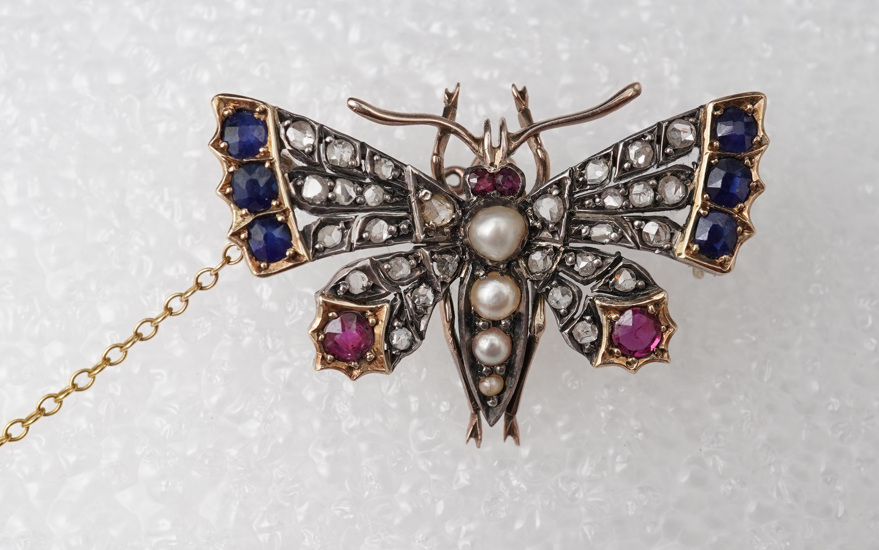 A Victorian ruby, sapphire, pearl and diamond brooch, late 19th century